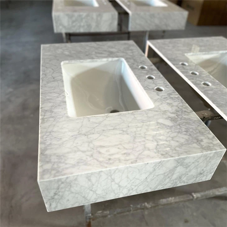 Carrara white countertops with bathroom cabinets